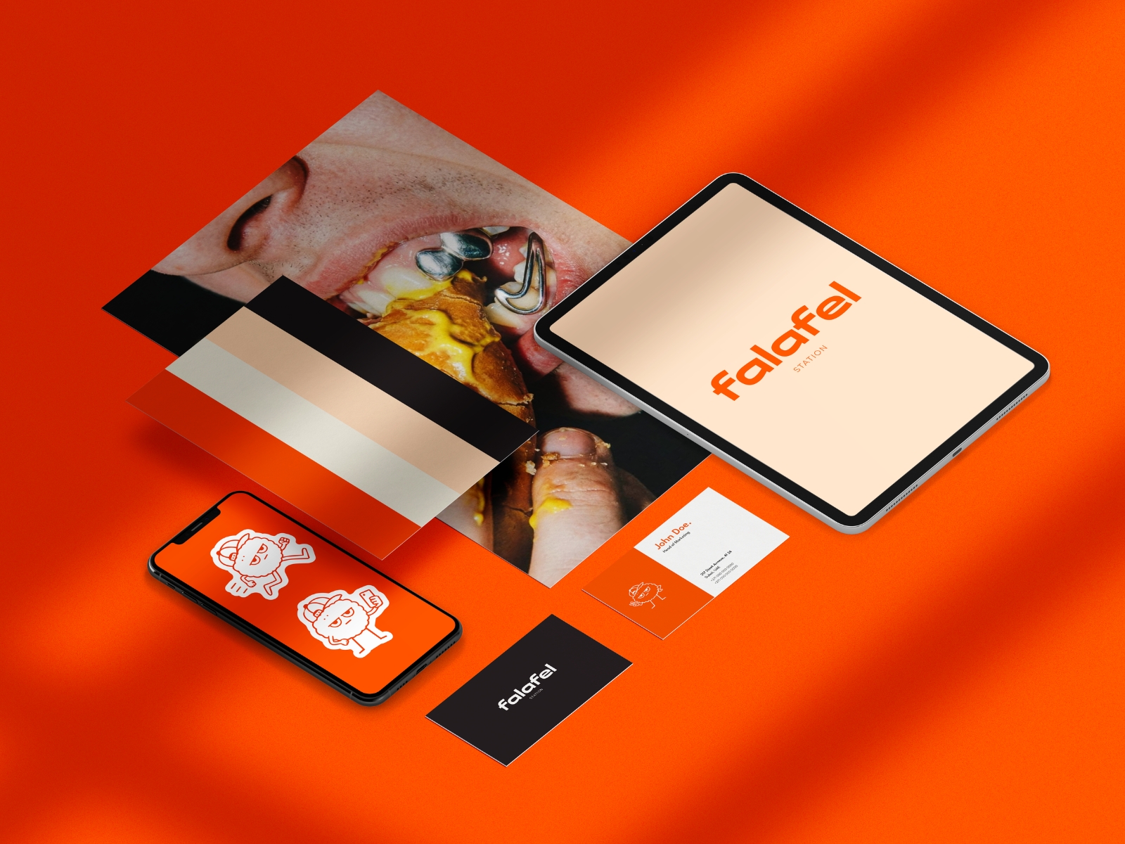 Falafel Station brand composite on orange: mascot stickers on a phone, the wordmark on a tablet, cards and a wrapper.