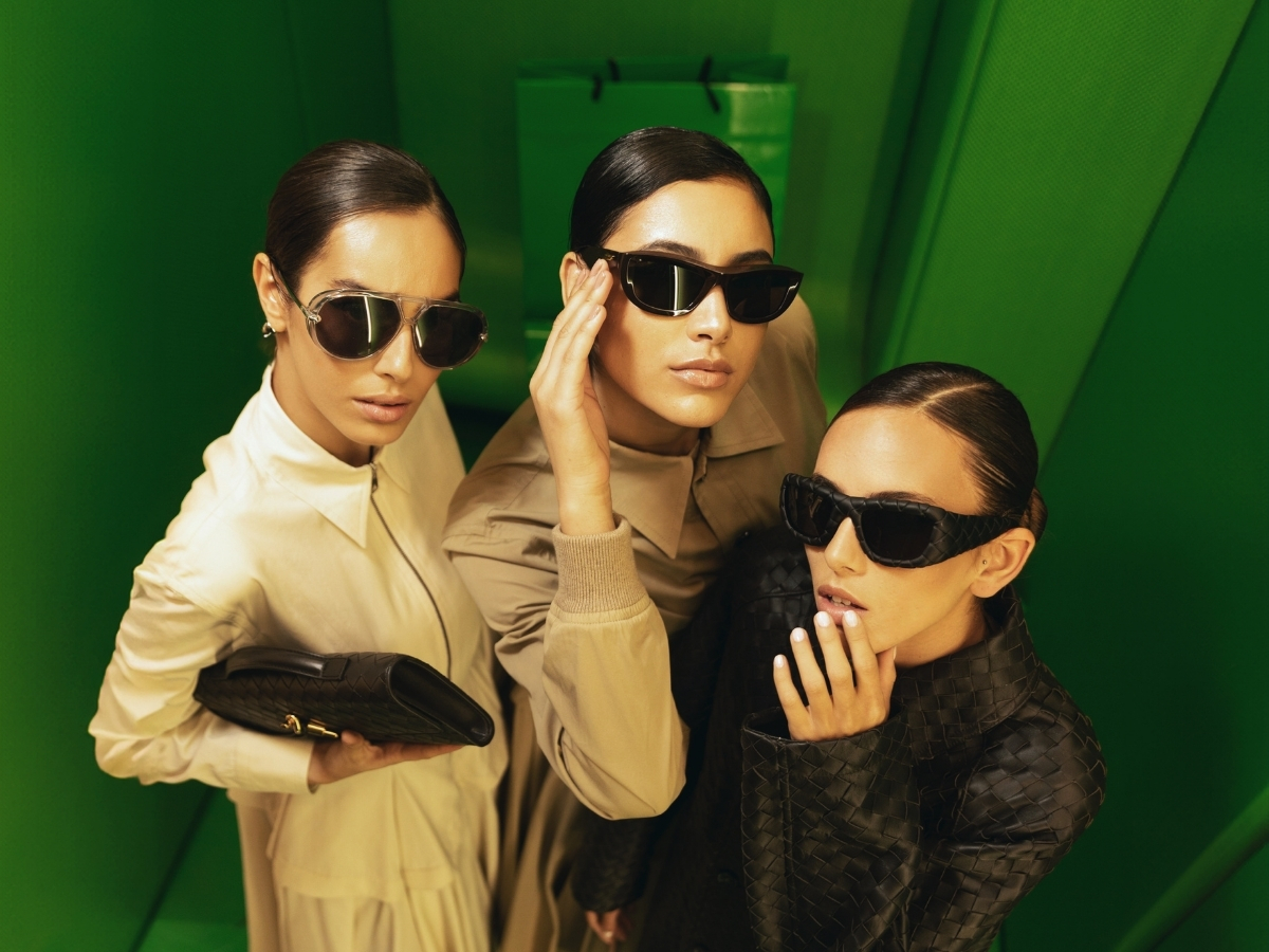 Morocco Mall campaign image on a green set: three women in sunglasses.